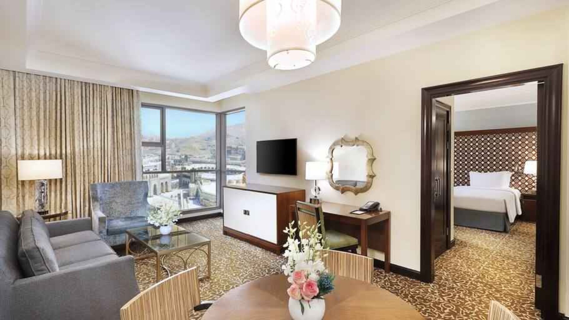 Living room with working station at the Hilton Suites Makkah.