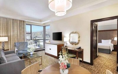 Living room with working station at the Hilton Suites Makkah.