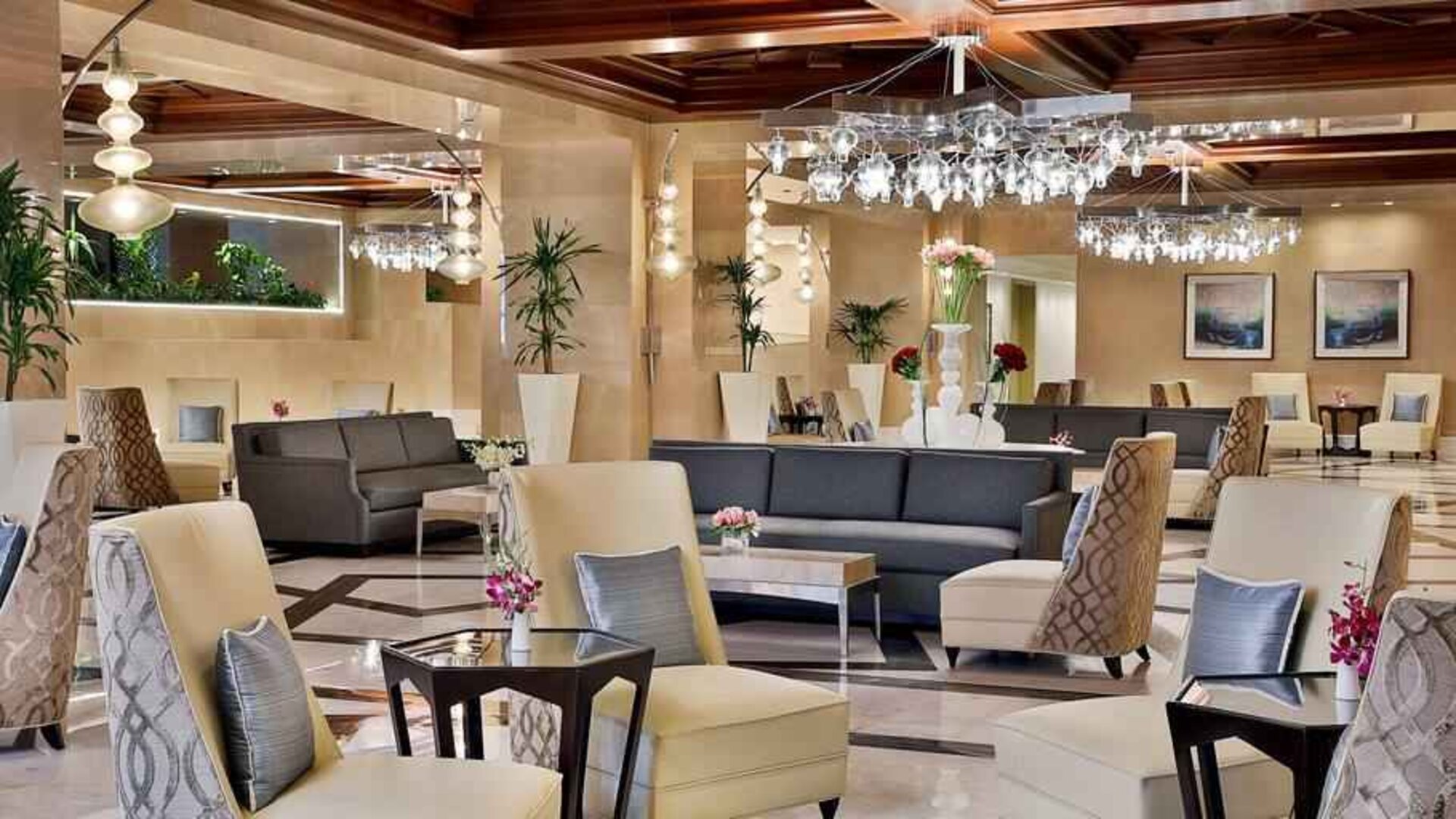 Hotel lobby woth sofas, tables and chairs at the Hilton Suites Makkah.