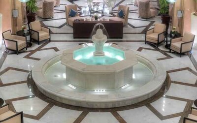Lobby workspace with fountain at the Hilton Suites Makkah.