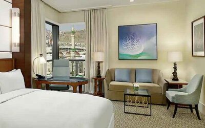 King bedroom with desk and sofa at the Conrad Makkah.