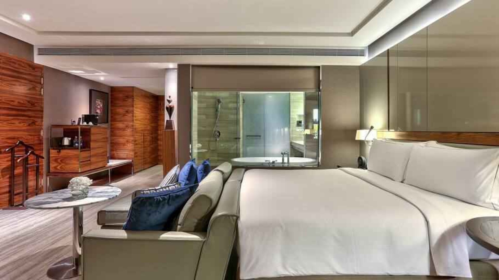 King suite with sofa and working station at the Hilton Sukhumvit Bangkok.