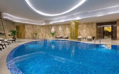stunning indoor pool with sunbeds at Hilton Astana.