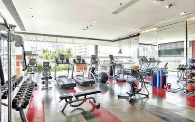 Fully equipped fitness center at the DoubleTree by Hilton Sukhumvit Bangkok.