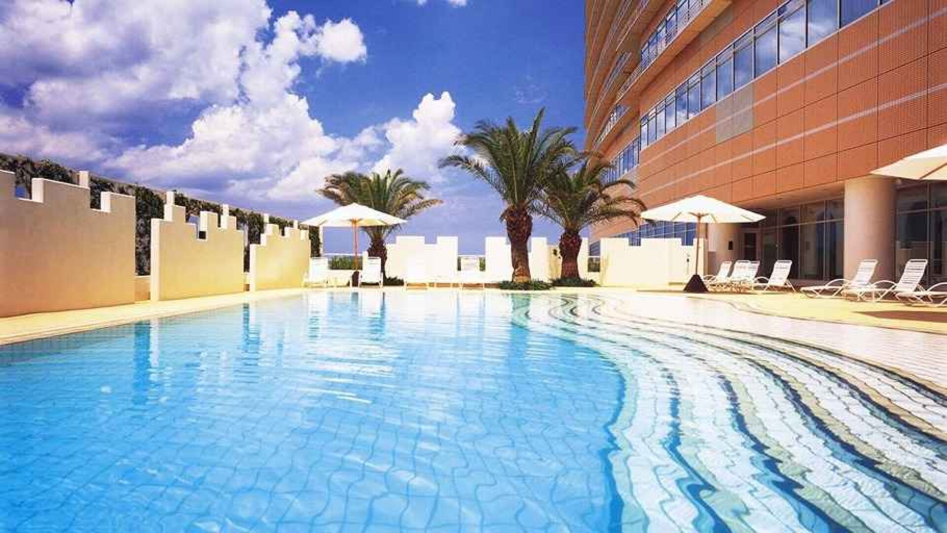 stunning outdoor pool with sunbeds at Hilton Fukuoka Sea Hawk.