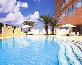 stunning outdoor pool with sunbeds at Hilton Fukuoka Sea Hawk.