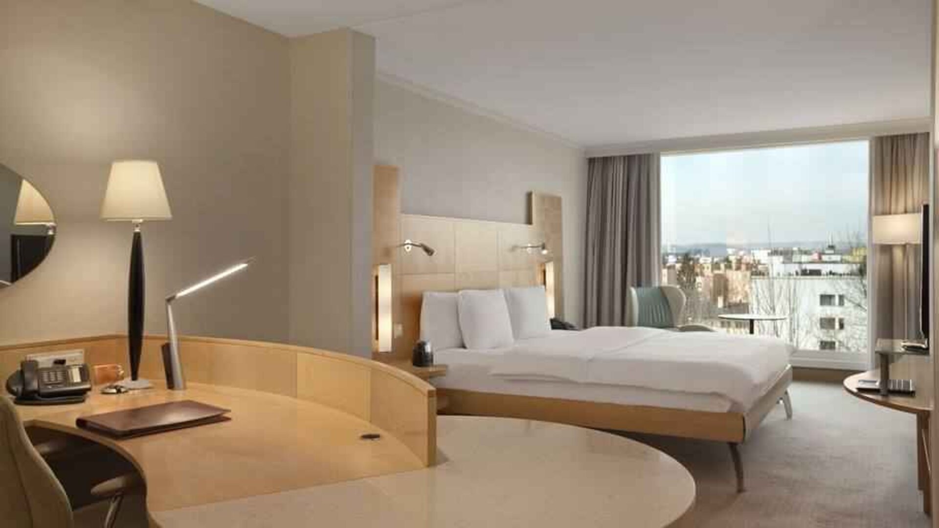 Spacious hotel room with working station at the Hilton Zurich Airport.