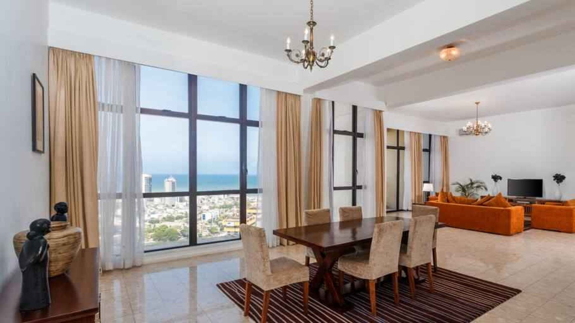 Living room with sofas, tables and chairs at the Hilton Colombo Residence.