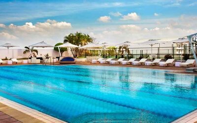 Relaxing outdoor pool area with lounges at the Hilton Colombo Residence.