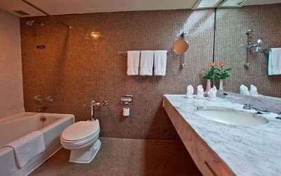 clean and spacious king bathroom with shower and bath combo at Hilton Addis Ababa.