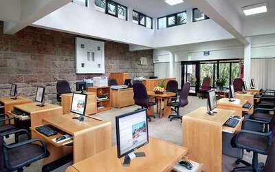 dedicated business center and workspace with PCs, internet, printers, and business desks at Hilton Addis Ababa.
