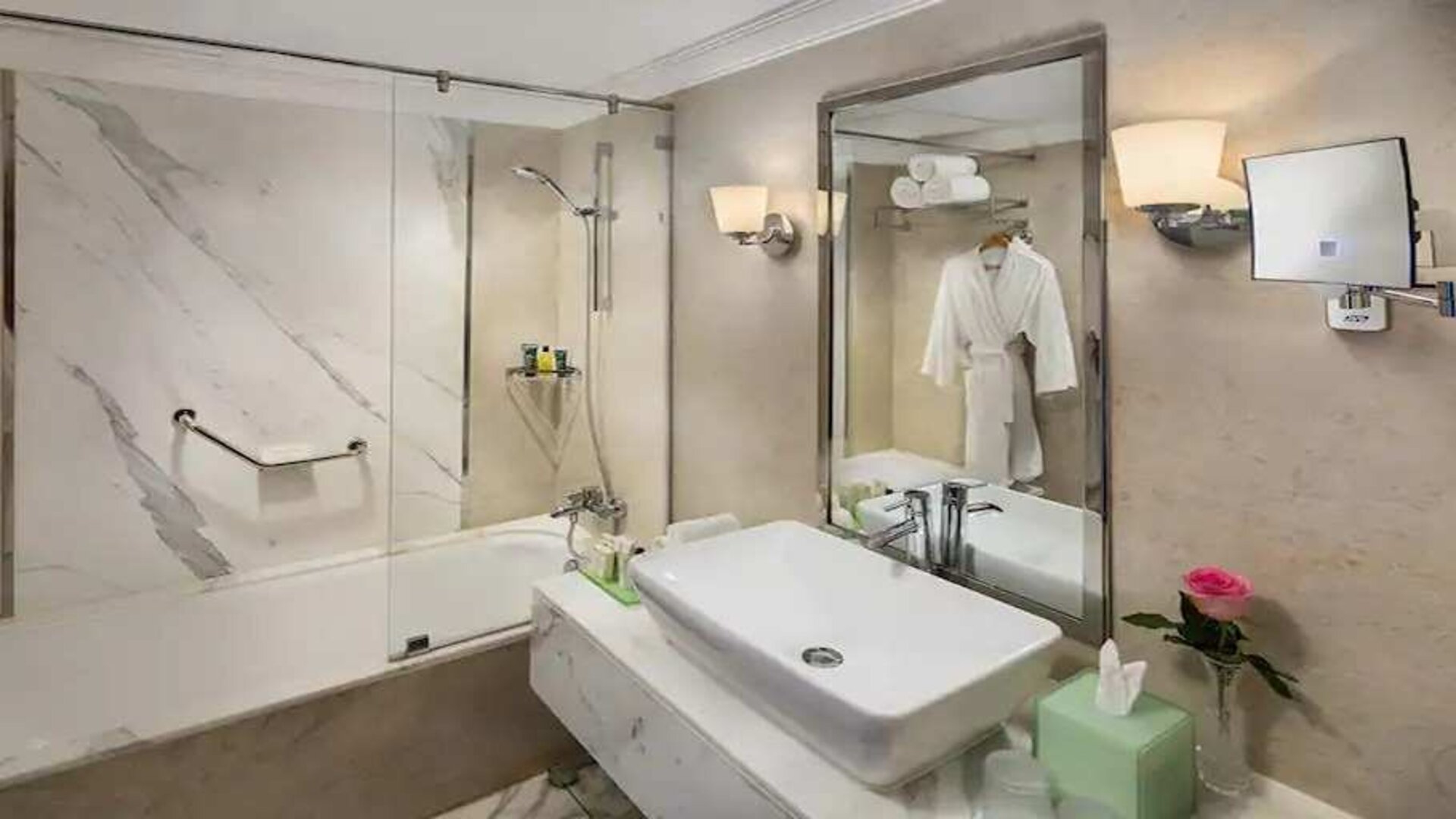 clean and spacious king bathroom with shower and bath combo at Hilton Alexandria Corniche.