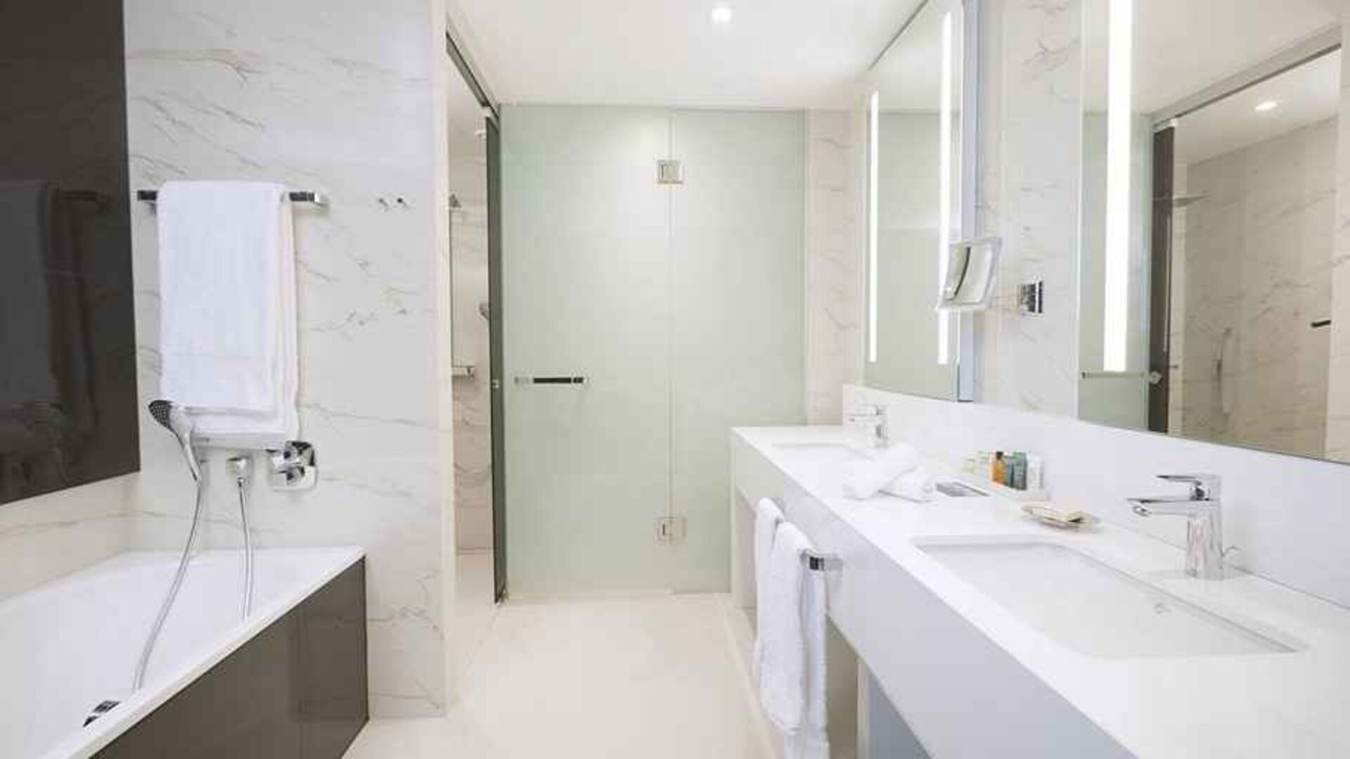 clean and spacious king bathroom with shower and bath at Hilton Tallinn Park.