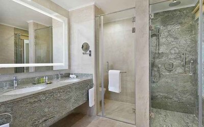 clean and spacious king bathroom with shower at Hilton Hurghada Plaza.