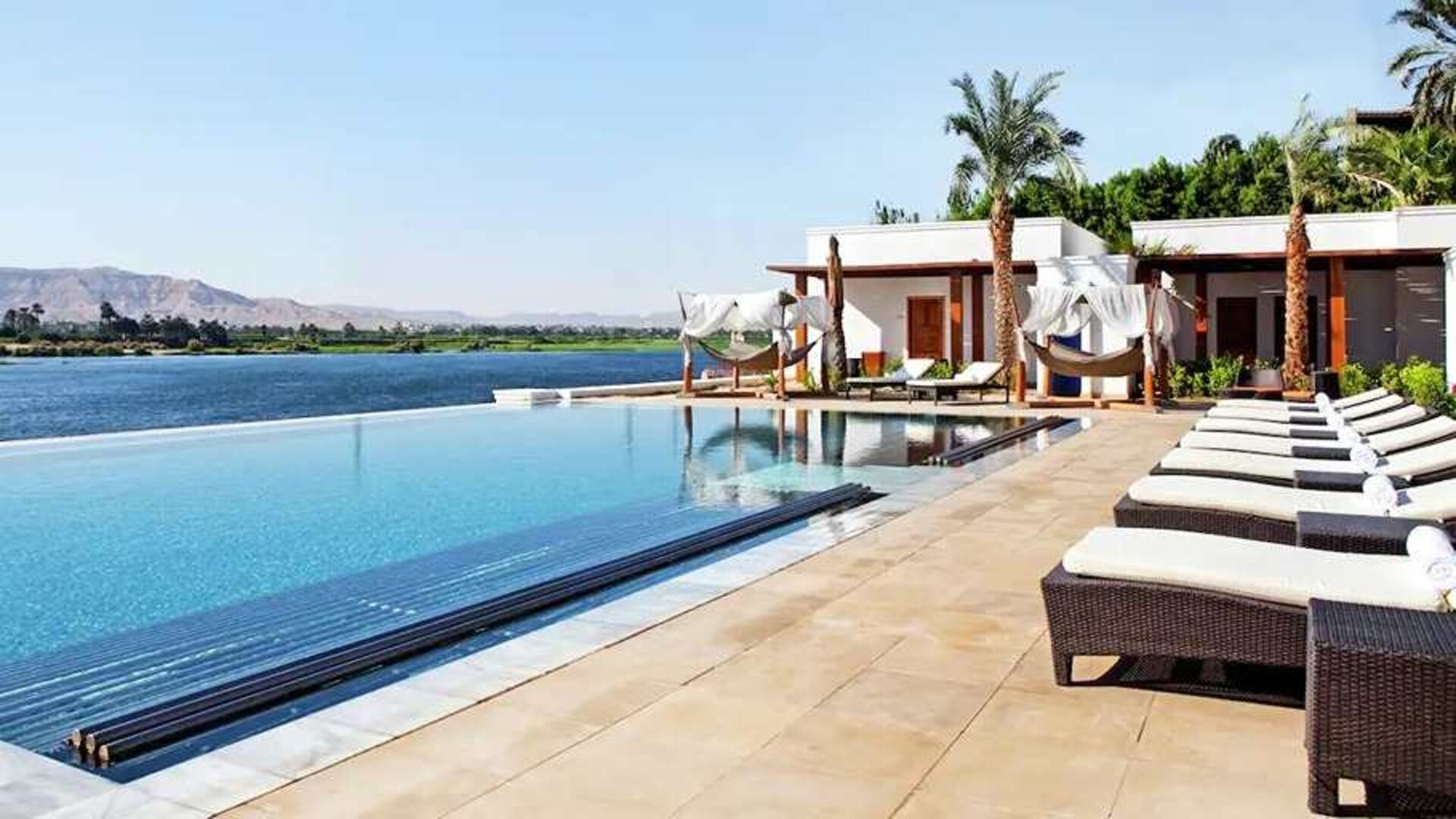 stunning outdoor pool with sunbeds at Hilton Luxor Resort & Spa.
