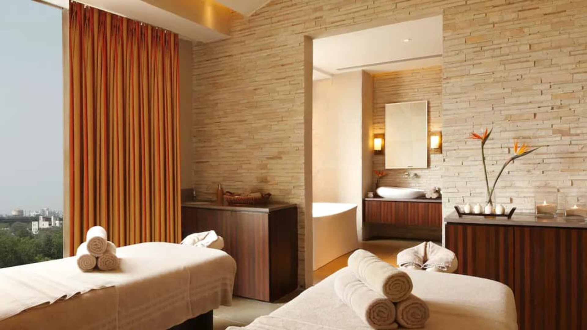 Beautiful brick-lined room with space for two massage tables, and a large view of Jaipur, India.