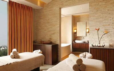 Beautiful brick-lined room with space for two massage tables, and a large view of Jaipur, India.
