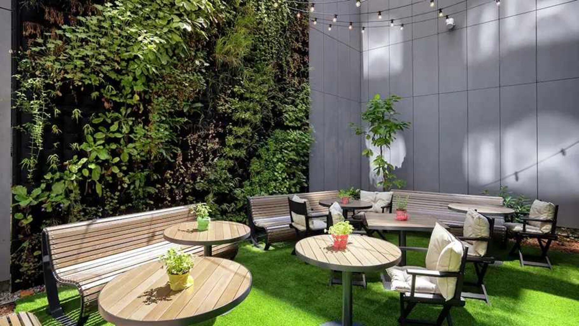pretty outdoor terrace with seating area ideal for coworking at Hilton Garden Inn Budapest City Centre.