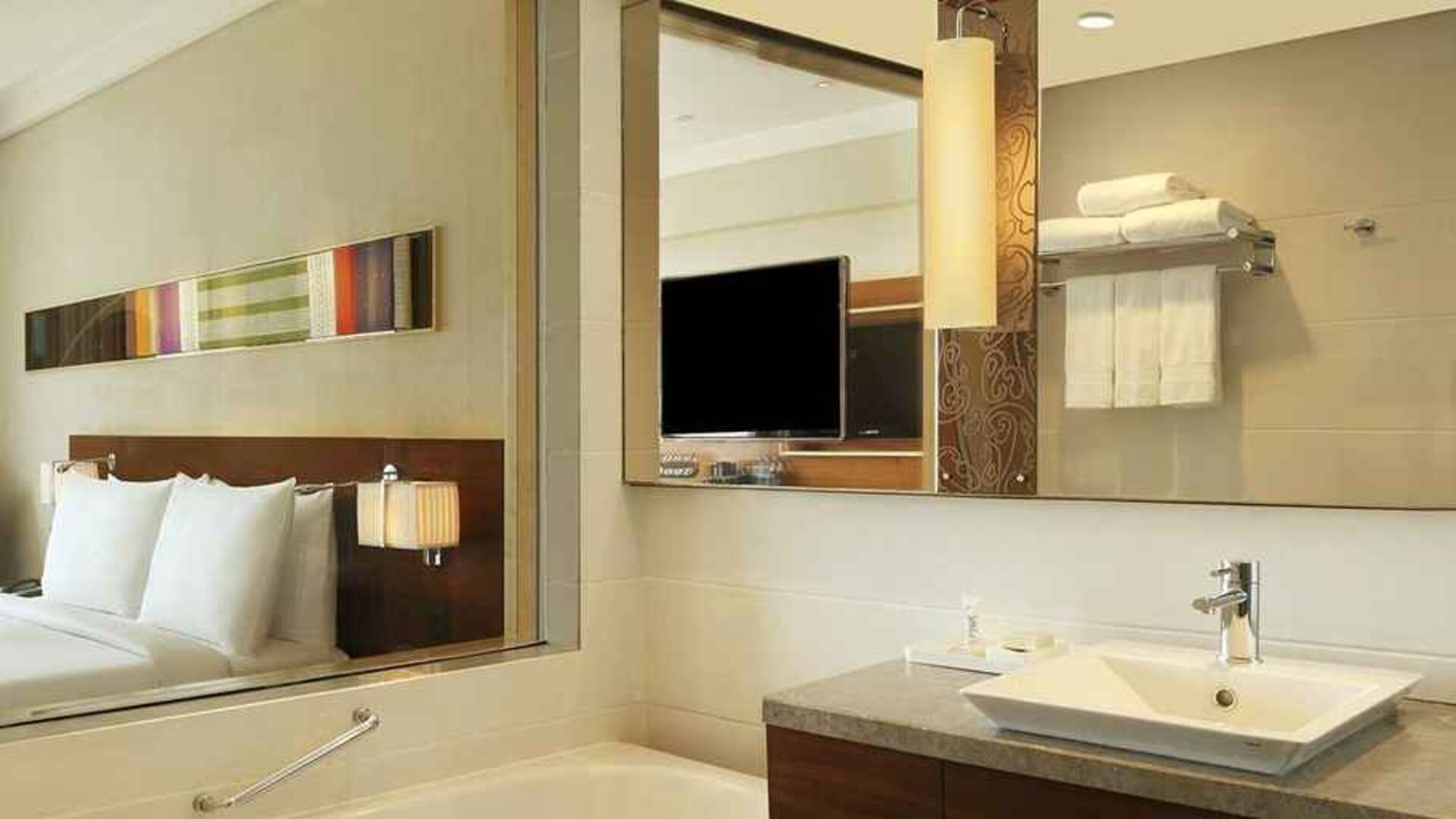 guest bathroom with bath and shower combo at Hilton Chennai.
