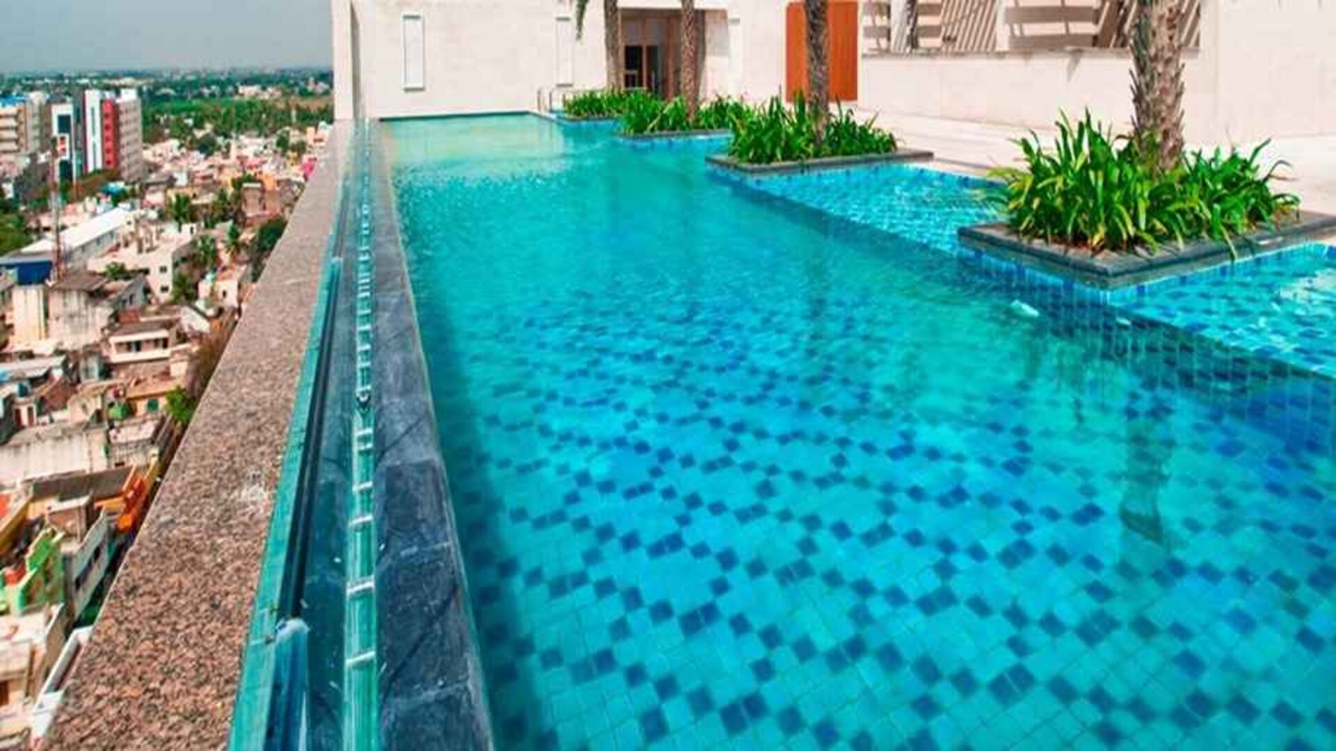 stunning outdoor pool with city views at Hilton Chennai.