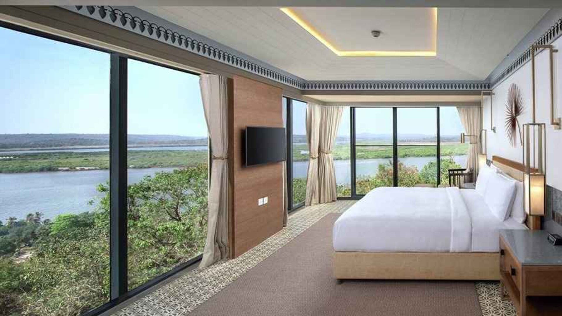 luxurious king suite with TV and gorgeous nature views at DoubleTree by Hilton Goa - Panaji.