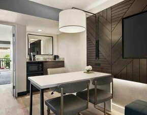 Spacious living room perfect as workspace at the Embassy Suites by Hilton Los Angeles Downey.