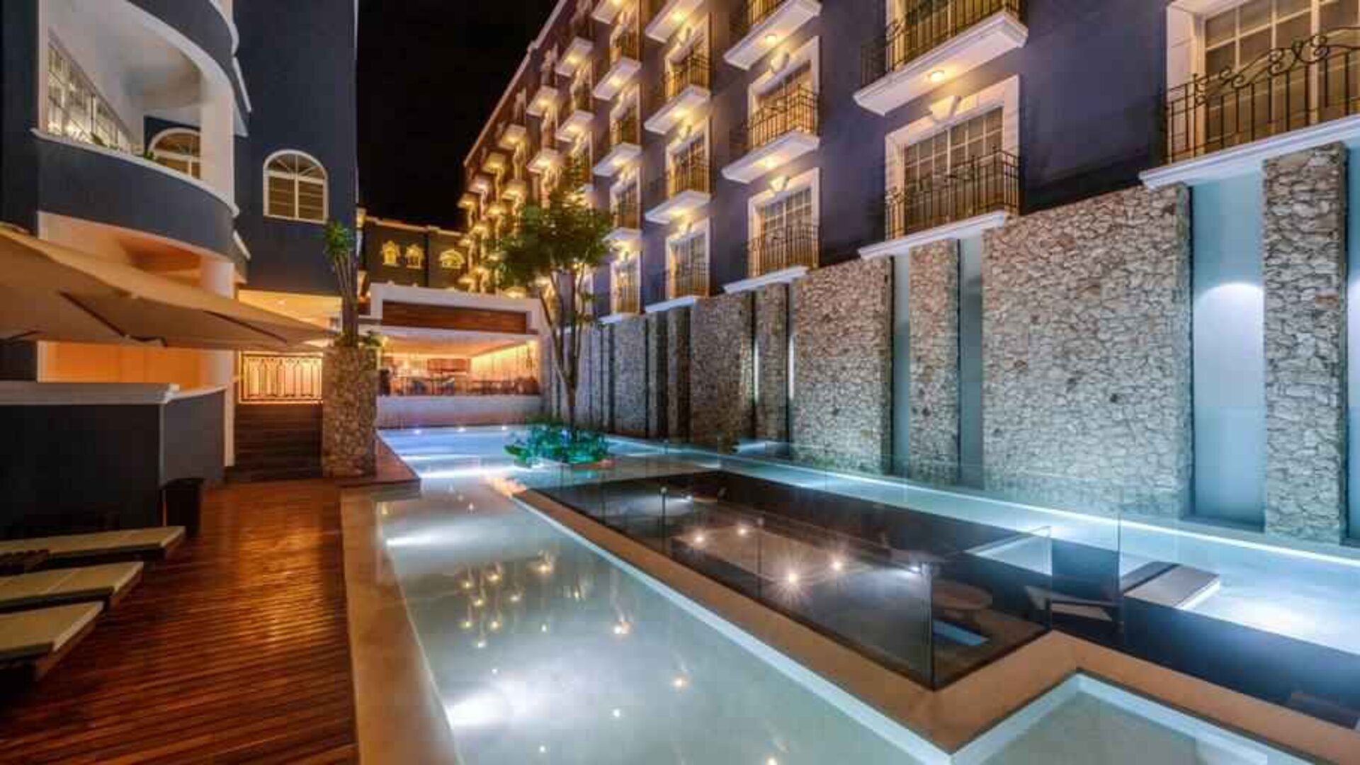 Pool by night at the Villa Mercedes Merida, Curio Collection by Hilton.