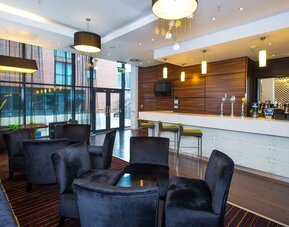 Cozy bar and restaurant seating.