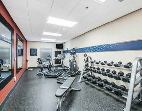 Fitness center with mirror at the Hampton Inn Greenfield.