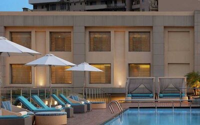 Relaxing outdoor pool area at the DoubleTree by Hilton Agra.