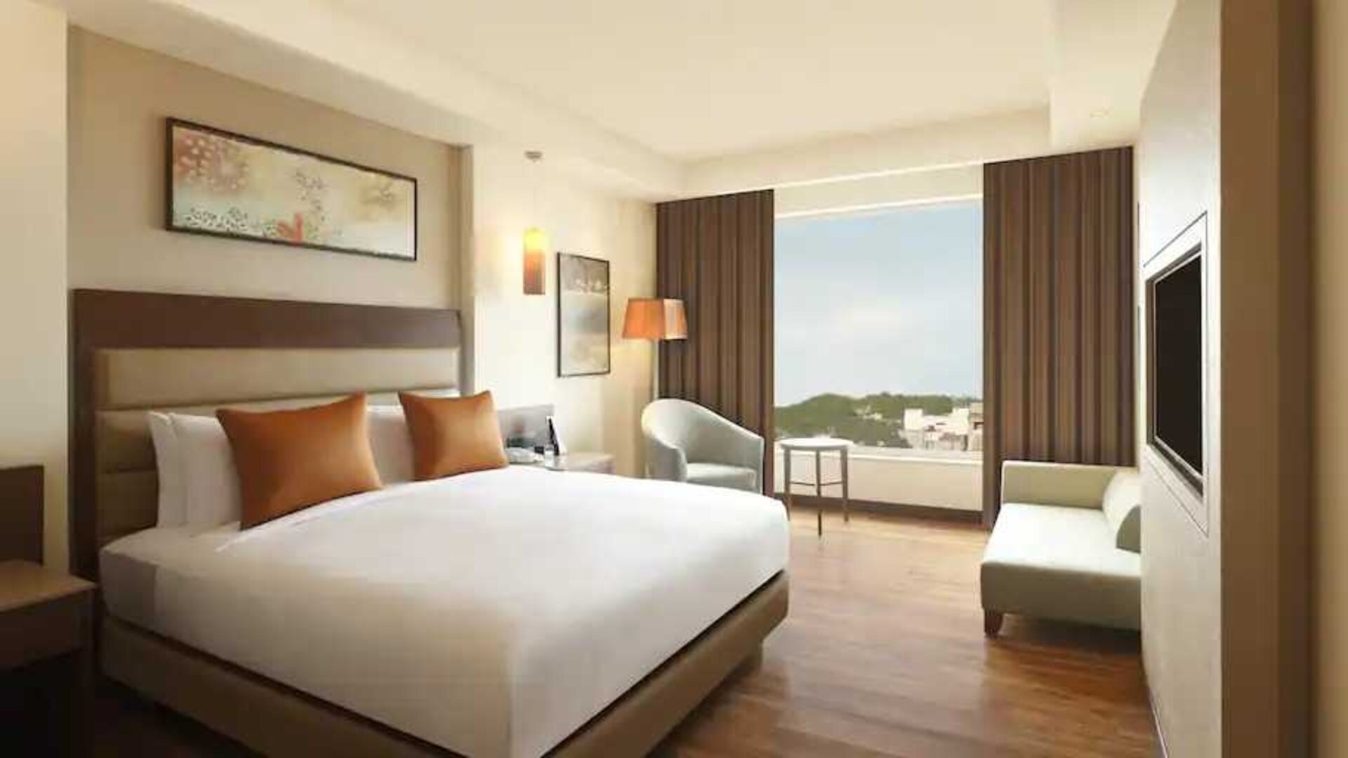 Hotel bedroom with window at the DoubleTree by Hilton Agra.