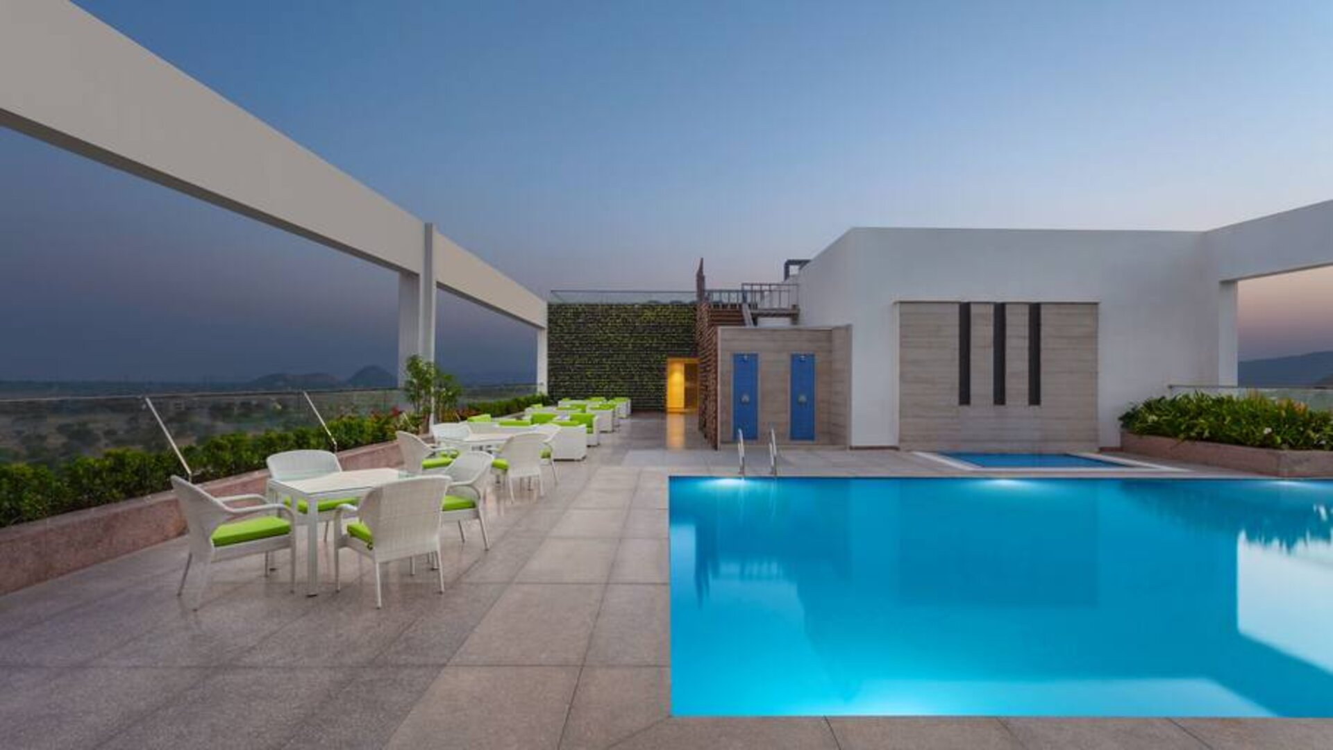 Relaxing outdoor pool area at the DoubleTree by Hilton Jaipur Amer.