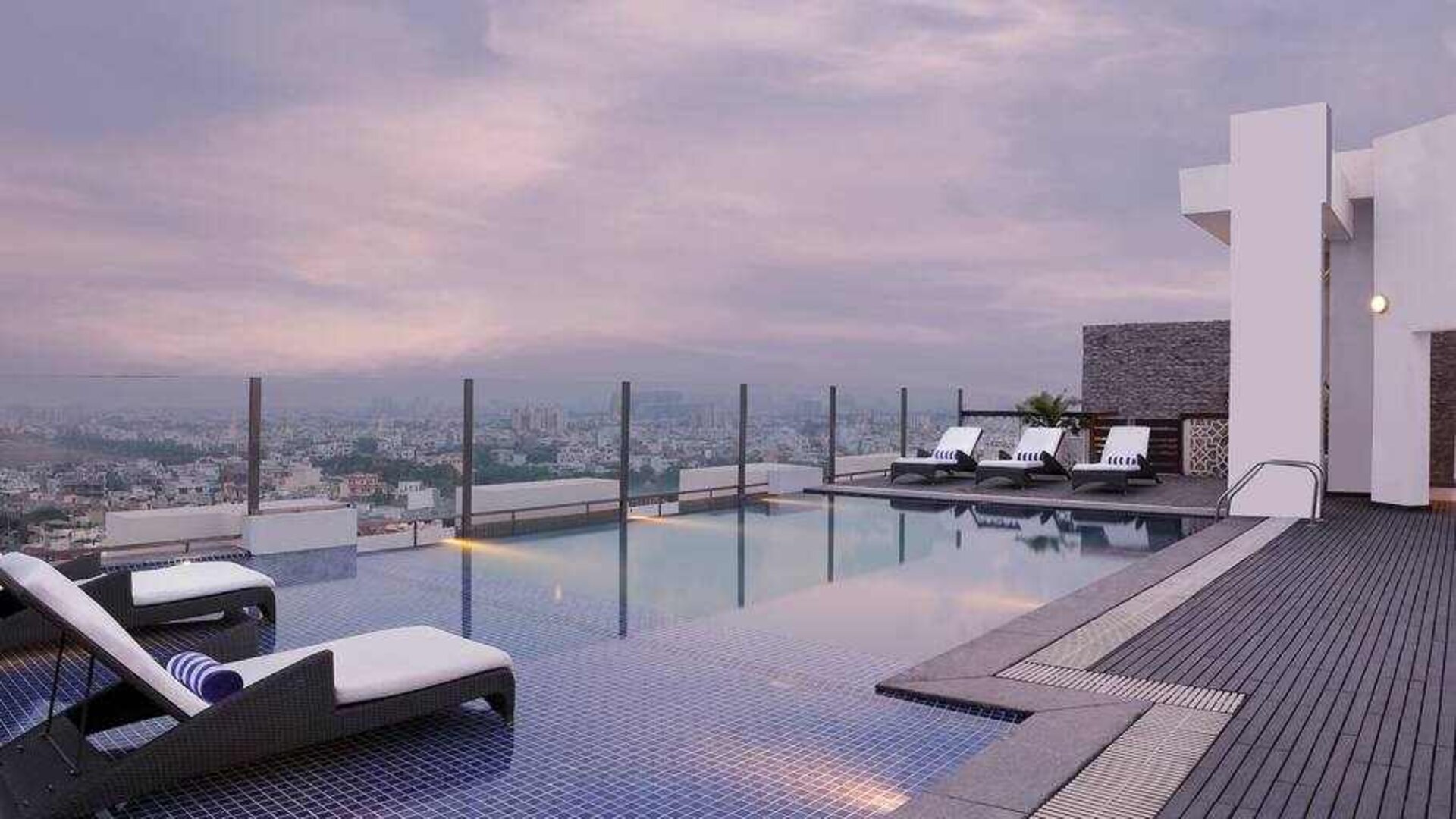 Relaxing outdoor pool at the DoubleTree by Hilton Gurugram Baani Square.