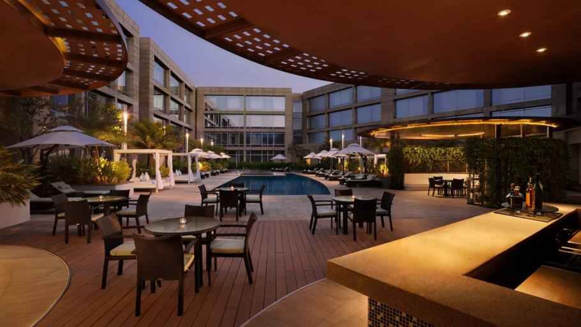Seating area by the pool perfect as workspace at the Hilton Bangalore Embassy GolfLinks.