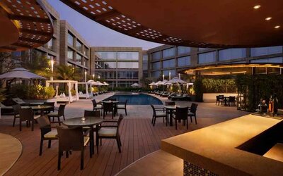 Seating area by the pool perfect as workspace at the Hilton Bangalore Embassy GolfLinks.
