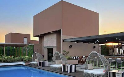 Relaxing outdoor pool at the DoubleTree Suites by Hilton Bangalore.