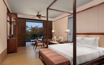 King bedroom with desk at the Hilton Goa Resort.