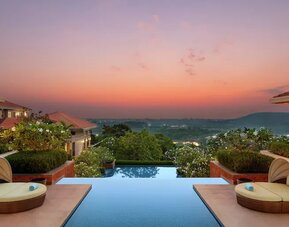 Outdoor pool area at the Hilton Goa Resort.