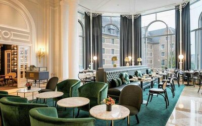 Seating area perfect as workspace at the Hilton Brussels Grand Place .