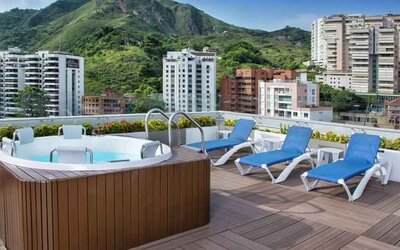 Outdoor terrace with pool at the Hampton by Hilton Cali.