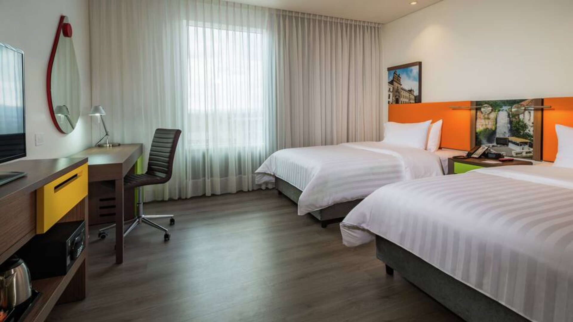 Twin room with working station at the Hampton by Hilton Bogota Airport.