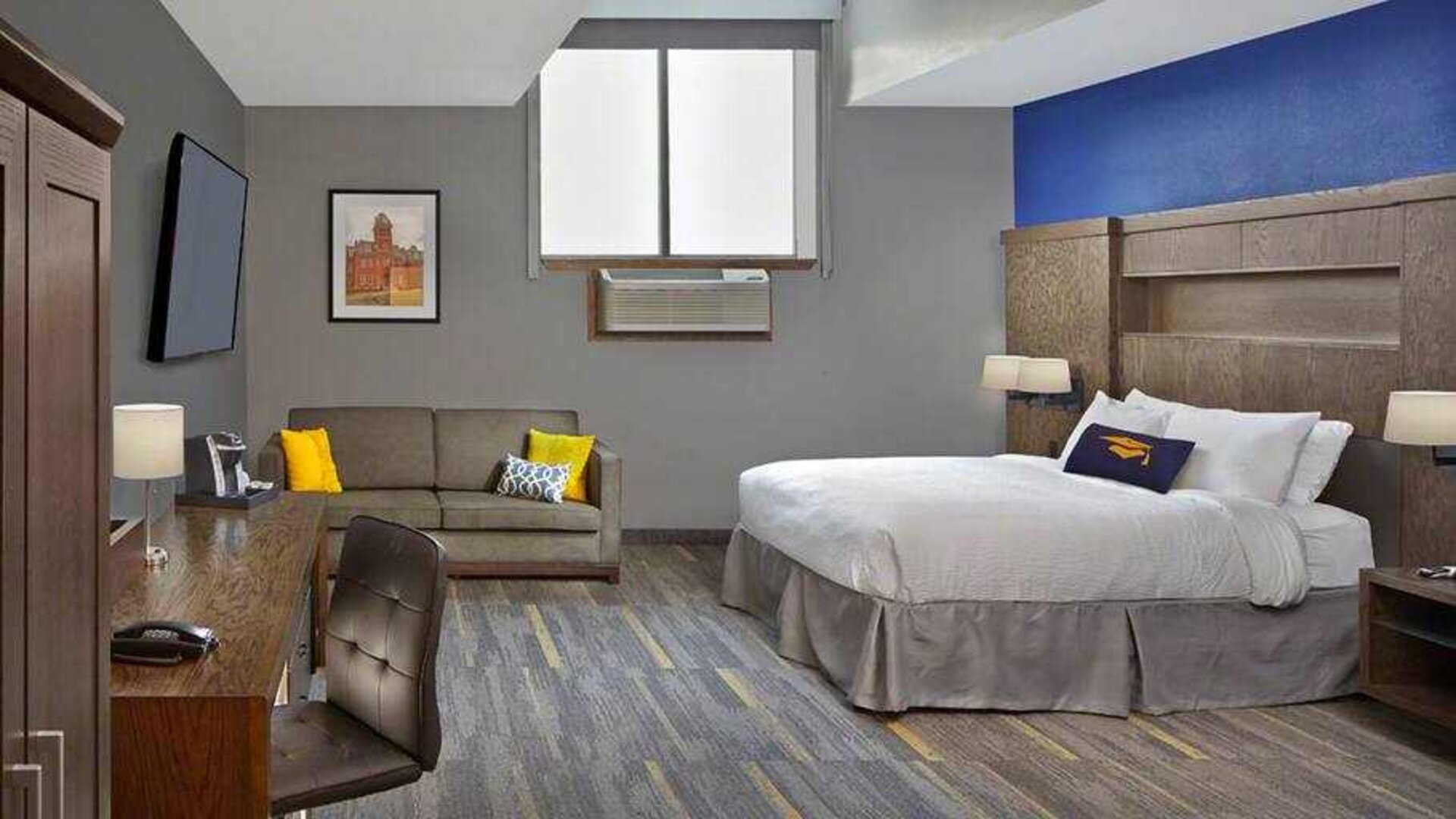 King bedroom with working station at the Tapestry By Hilton Scholar Morgantown, WV.