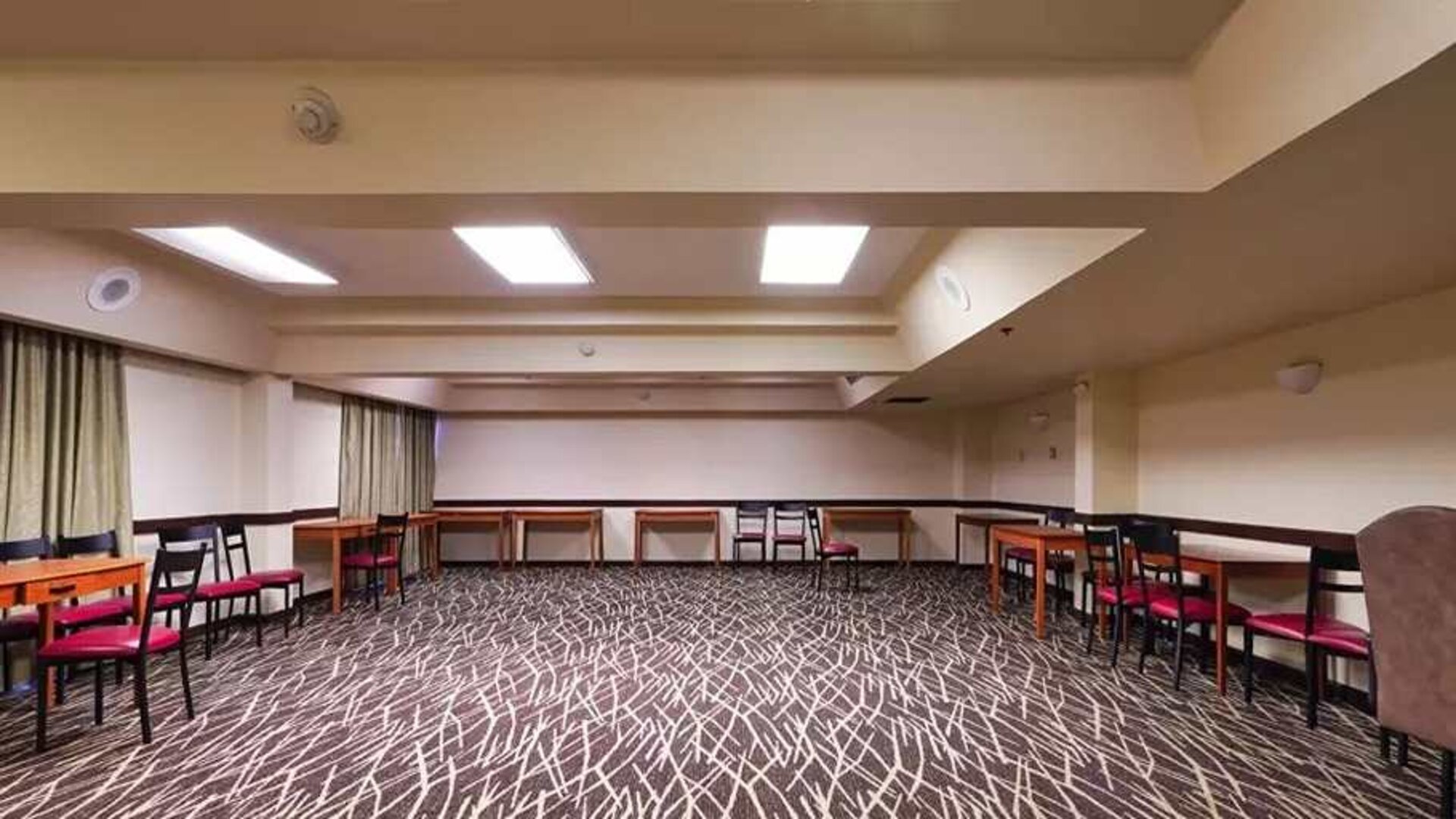 Quiet meeting room ideal for working remotely or for business meetings at Red Roof PLUS+ & Suites Houston - IAH Airport SW.