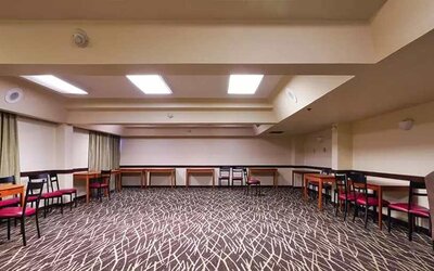 Quiet meeting room ideal for working remotely or for business meetings at Red Roof PLUS+ & Suites Houston - IAH Airport SW.