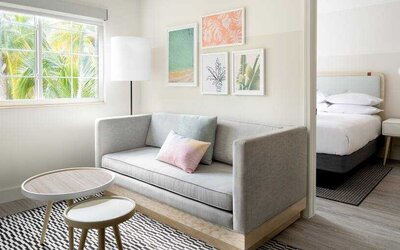 Living room perfect as workspace at the Hampton By Hilton Grand Cayman.