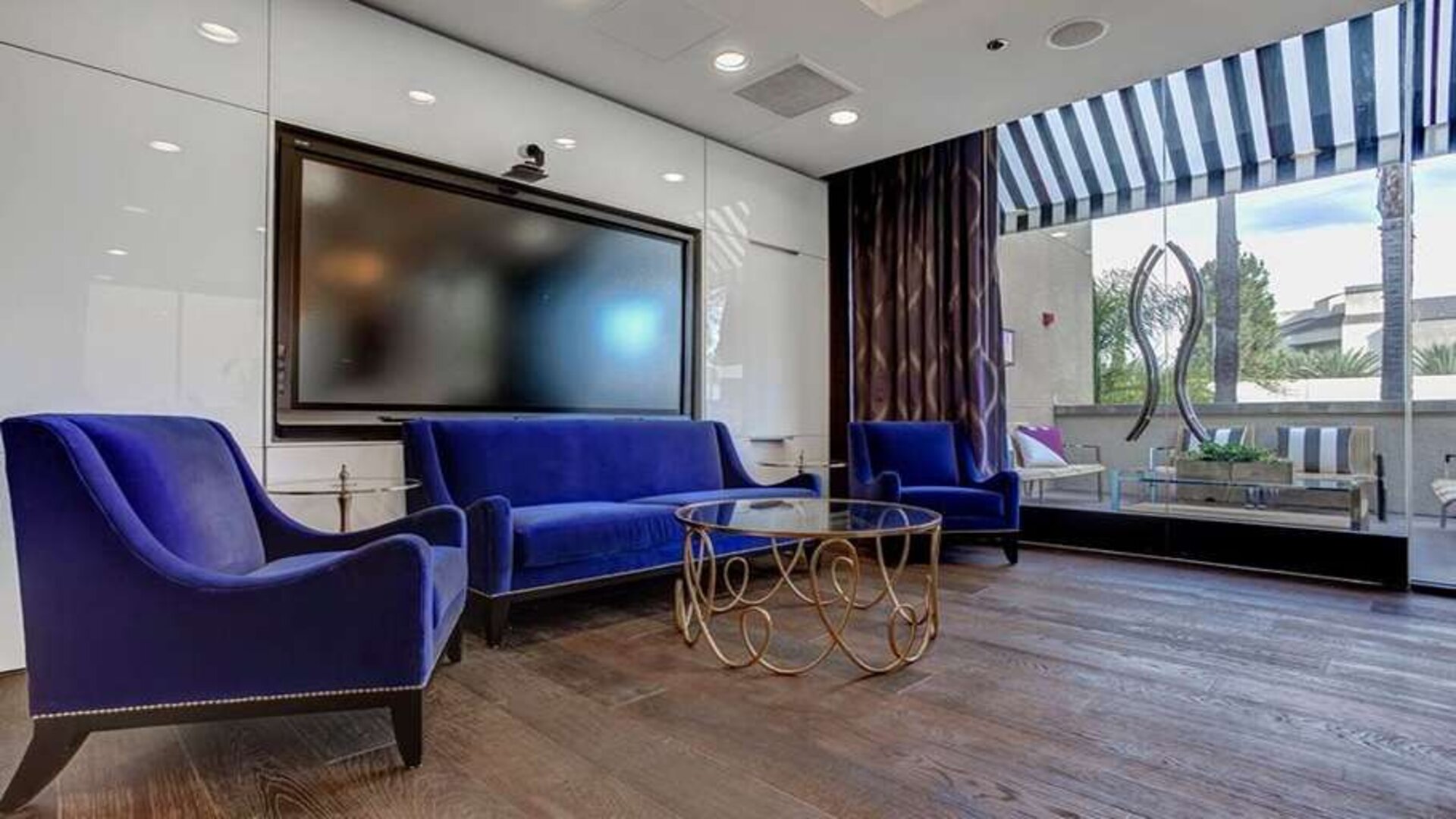 Hotel workspace with TV screen at Avenue Of The Arts Hotel.