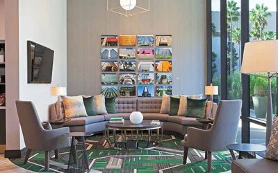 Lobby and coworking lounge at H Hotel Los Angeles, Curio Collection By Hilton.
