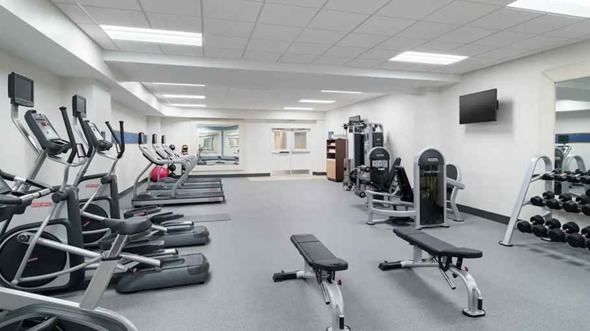 well equppied fitness center with weights and exercise equipment at Hampton Inn Philadelphia Center City-Convention Center.