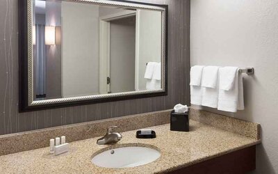 Guest bathroom with shower at Courtyard Miami Dolphin Mall.