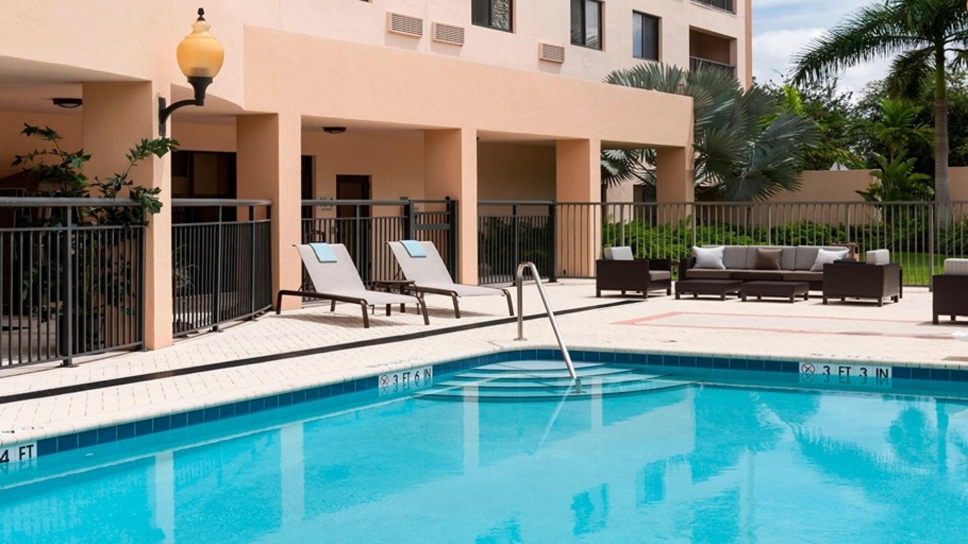 Refreshing outdoor pool at Courtyard Miami Dolphin Mall.
